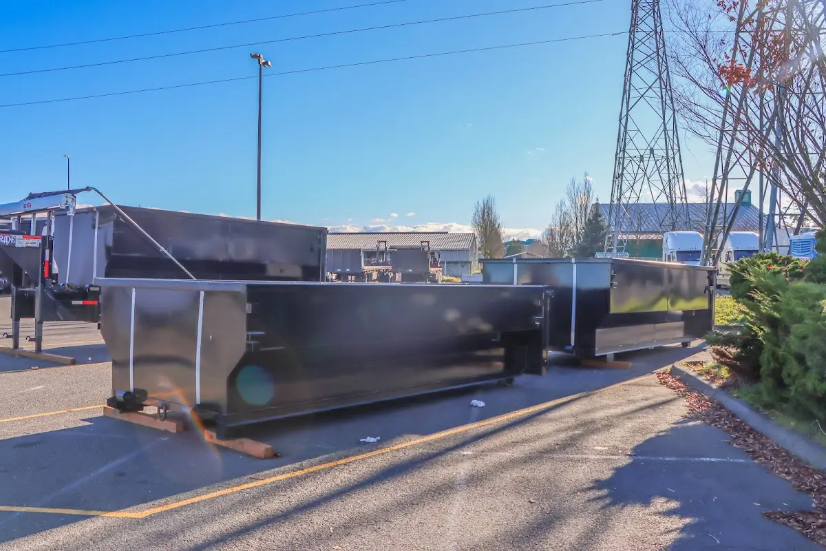 Roll-off dumpster ready for waste disposal at job site for 2 Yard Dumpster Rental in Buxton